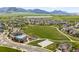 Aerial view of the community recreation center, pool, playground and green space at 16262 W 95Th Ln, Arvada, CO 80007