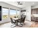 Dining area with modern table set, scenic views, and a convenient pantry at 16262 W 95Th Ln, Arvada, CO 80007
