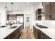Well-lit kitchen with stainless appliances, gas range, and island seating at 16262 W 95Th Ln, Arvada, CO 80007