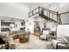 Open-concept living room boasts a modern design and seamless flow with connecting rooms at 16262 W 95Th Ln, Arvada, CO 80007