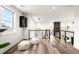 Bright loft space with modern design elements and stylish railing overlooking the stairwell at 16262 W 95Th Ln, Arvada, CO 80007