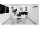 Modern office space with sleek desk, stylish shelving, and minimalist decor at 16262 W 95Th Ln, Arvada, CO 80007