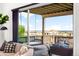 Outdoor porch with comfortable swing and furniture, offering scenic views at 16262 W 95Th Ln, Arvada, CO 80007