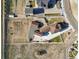 Aerial view showcasing the home's layout, ample parking, and expansive grounds at 16101 Iola St, Brighton, CO 80602