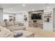 The finished basement has custom built-in shelving and a stone accent wall at 15021 Josephine St, Thornton, CO 80602