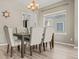 Dining room features hardwood floors and a window with natural light at 15021 Josephine St, Thornton, CO 80602