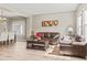Living room with view of the dining area and hardwood floors at 15021 Josephine St, Thornton, CO 80602