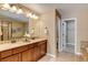 Bathroom with dual vanity sinks and a tub/shower combo at 4742 Raven Run, Broomfield, CO 80023