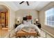 Neutral bedroom featuring a decorative rug, bench, and art hanging above the bed at 4742 Raven Run, Broomfield, CO 80023
