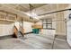 Two-car garage features painted walls, access door to interior, and lots of storage at 4742 Raven Run, Broomfield, CO 80023