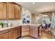 Kitchen with granite countertops, stainless appliances, and open to living area at 4742 Raven Run, Broomfield, CO 80023