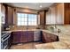 Updated kitchen with granite countertops, stainless appliances, and ample storage at 4742 Raven Run, Broomfield, CO 80023