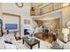 Cozy living room with fireplace, hardwood floors and open layout at 4742 Raven Run, Broomfield, CO 80023