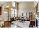 Bright living room features high ceilings, modern decor, and hardwood floors at 4742 Raven Run, Broomfield, CO 80023