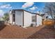 Spacious backyard featuring wooden fence, healthy, mature trees, and an A/C unit at 11820 Lincoln St, Northglenn, CO 80233
