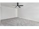 Neutral bedroom features plush carpeting and a modern ceiling fan at 11820 Lincoln St, Northglenn, CO 80233