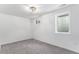Bedroom features plush carpet, white walls, and a bright window at 11820 Lincoln St, Northglenn, CO 80233