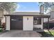 Charming single-Gathering home with a white brick facade, brown garage door, and a well-maintained front yard at 11820 Lincoln St, Northglenn, CO 80233