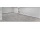 Spacious finished basement with neutral carpet and white walls at 11820 Lincoln St, Northglenn, CO 80233