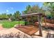 Backyard featuring a patio, a beautiful gazebo, and green lawn at 9994 Quintero St, Commerce City, CO 80022