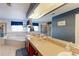 Large bathroom featuring a soaking tub, double sinks with spacious countertop and large mirror, as well as a glass door shower at 9994 Quintero St, Commerce City, CO 80022