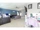 This is a very spacious main bedroom boasting a fireplace, ceiling fan, and a vanity area at 9994 Quintero St, Commerce City, CO 80022