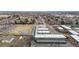 Overhead view capturing a low rise apartment complex, parking lot, and field near residential area at 11455 W 17Th Pl, Lakewood, CO 80215