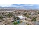 Aerial view of a church, playground and parking area nestled in a scenic, suburban location at 11455 W 17Th Pl, Lakewood, CO 80215