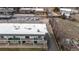 High-angle view of a multi-story apartment building with balconies, parking, and adjacent street at 11455 W 17Th Pl, Lakewood, CO 80215
