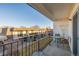 Balcony overlooking the neighborhood with a table and chairs for outdoor relaxation at 11455 W 17Th Pl, Lakewood, CO 80215