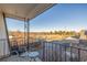 Outdoor balcony with seating area providing a view of the surrounding landscape at 11455 W 17Th Pl, Lakewood, CO 80215