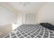 Bedroom featuring a large bed, ceiling fan, and ample closet space at 11455 W 17Th Pl, Lakewood, CO 80215