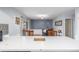 Cozy dining area with wood chairs and bar seating, perfect for Gathering meals and entertaining at 11455 W 17Th Pl, Lakewood, CO 80215