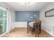 Dining room featuring hardwood floors and a stylish dining table with seating for four at 11455 W 17Th Pl, Lakewood, CO 80215