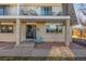 Charming condo facade with a brick exterior, balcony, and lovely curb appeal at 11455 W 17Th Pl, Lakewood, CO 80215