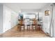 Stylish kitchen featuring a breakfast bar with seating, white cabinets, and stainless steel appliances at 11455 W 17Th Pl, Lakewood, CO 80215