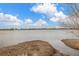 Scenic view of a serene lake under a bright sky, showcasing the natural beauty of the area at 11455 W 17Th Pl, Lakewood, CO 80215