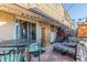 Cozy outdoor patio with dining table and comfortable seating area, perfect for relaxation and entertainment at 11455 W 17Th Pl, Lakewood, CO 80215