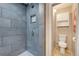 Bathroom with large tiled shower stall and toilet in separate alcove at 4642 Plettner Ln, Evergreen, CO 80439