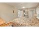 Bedroom boasts hardwood floors, decorative ceiling tiles and convenient access to the laundry at 4642 Plettner Ln, Evergreen, CO 80439
