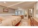 Serene bedroom with an ensuite closet, and convenient access to an outdoor deck at 4642 Plettner Ln, Evergreen, CO 80439