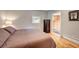 Bedroom featuring hardwood floors, a comfortable bed, and a window for natural light at 4642 Plettner Ln, Evergreen, CO 80439