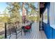 Deck area with furniture, grill and umbrella featuring gorgeous views of natural surroundings at 4642 Plettner Ln, Evergreen, CO 80439