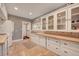 Kitchen with white cabinets, tile floor, and natural wood countertop at 4642 Plettner Ln, Evergreen, CO 80439