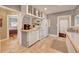 Kitchen with white appliances and cabinets, and access to living space at 4642 Plettner Ln, Evergreen, CO 80439