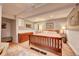 Cozy bedroom with a wooden bed frame, dresser, and neutral decor at 4642 Plettner Ln, Evergreen, CO 80439