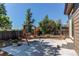 Relaxing backyard featuring a concrete patio and inviting swing seat for enjoying outdoor leisure at 4392 E 126Th Pl, Thornton, CO 80241