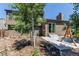 Home featuring a fenced backyard, patio, small garden and mature landscaping at 4392 E 126Th Pl, Thornton, CO 80241