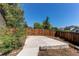 Spacious backyard featuring a concrete patio, wooden fence and some trees providing a private outdoor space at 4392 E 126Th Pl, Thornton, CO 80241