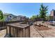 Fenced backyard featuring garden beds filled with soil, perfect for gardening and outdoor enjoyment at 4392 E 126Th Pl, Thornton, CO 80241